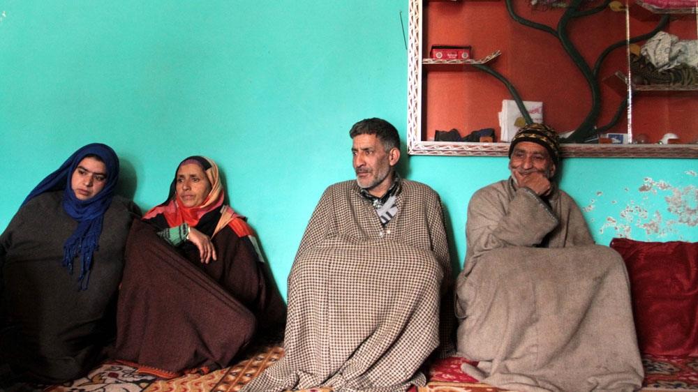 Javed Ahmad Lone, Suhail's father (second from right) [Shuaib Bashir/Al Jazeera]