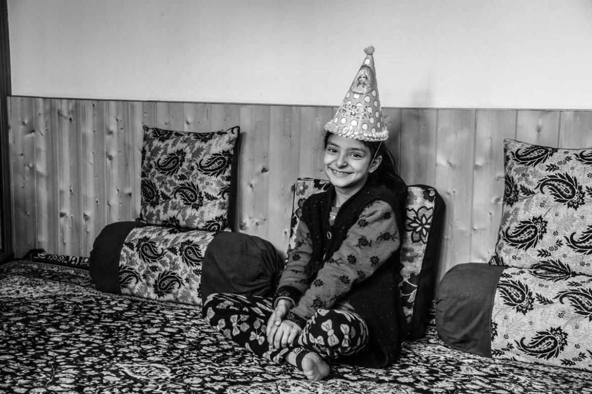 Nine-year-old Zohra posing for a photo on her birthday inside her home in Srinagar city, the summer capital of Indian-controlled Kashmir. Her father, a police officer was shot dead by gunmen while on