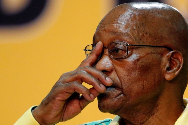 President of South Africa Jacob Zuma gestures to his supporters at the 54th National Conference of the ruling ANC at the Nasrec Expo Centre in Johannesburg