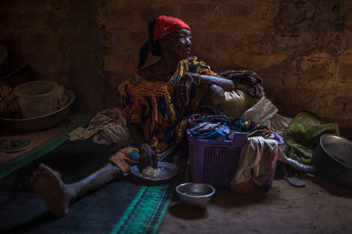 A displaced elderly woman sits with her belongings inside the Saramandja Church, which is hosting IDPs in Paoua, Central African Republic, January 31, 2018.