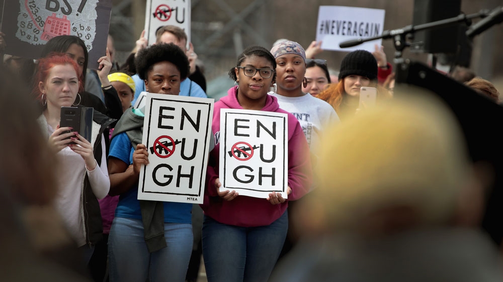 People join a rally to show support for students who finished the last leg of a 50-mile journey in the hometown of Paul Ryan to call attention to gun violence [Scott Olson/Getty Images/AFP]