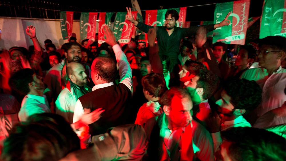 
PTI supporters celebrate projected unofficial results in Islamabad [BK Bangash/AP] 
