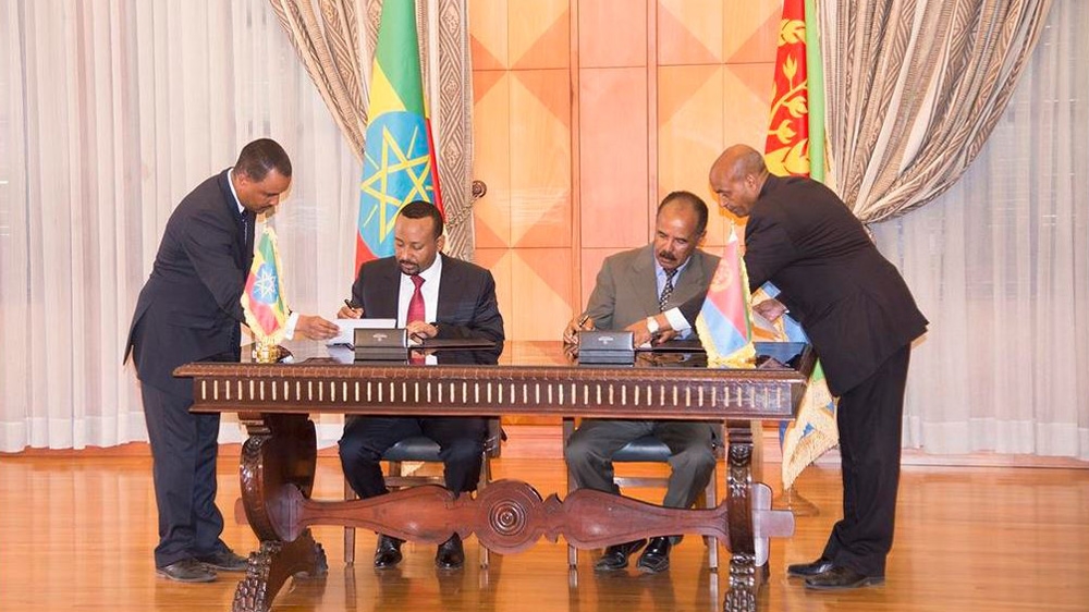 Abiy signed an agreement with Eritrean President Isaias Afkwerki on Monday [Al Jazeera]