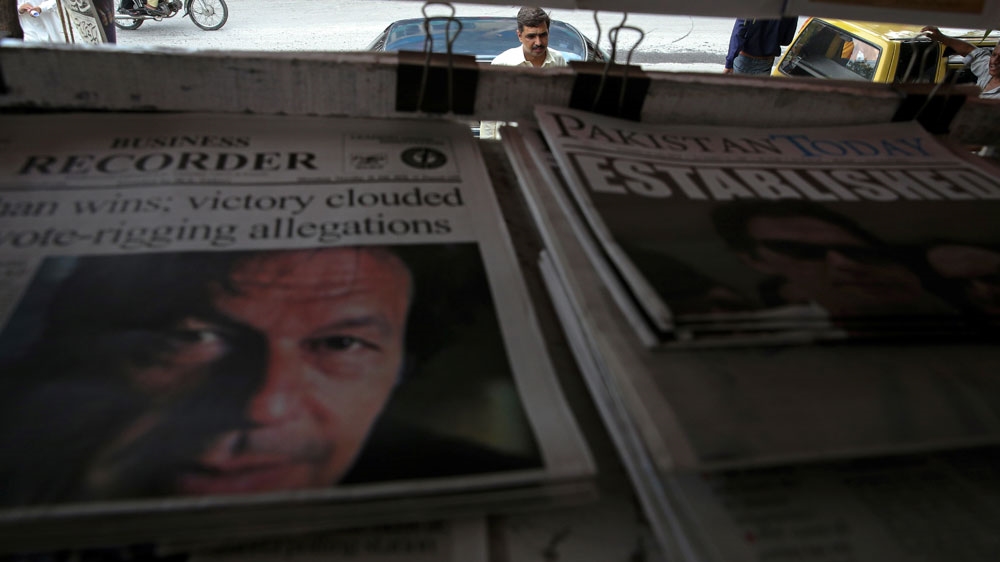 Pakistani newspapers displayed Imran Khan on their front pages [Athit Perawongmetha/Reuters]