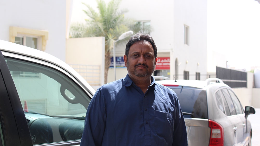 Mujtaba Nazar moved to Doha from Lahore three years ago to earn a better livelihood as a driver [Saba Aziz/Al Jazeera] 