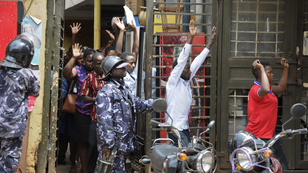 Security forces have tried to contain demonstrations over the detention of opposition MPs [Ronald Kabuubi/AP]