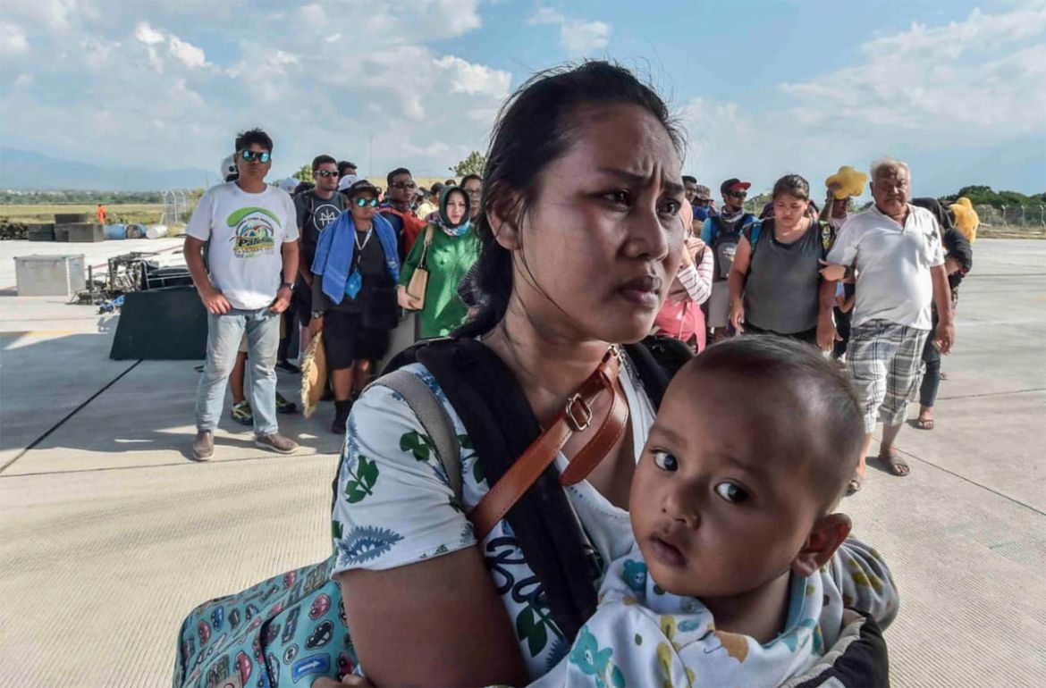 People injured or affected by the earthquake and tsunami wait to be evacuated on an air force plane in Palu, Central Sulawesi, Indonesia, September 30, 2018. Antara Foto/Muhammad Adimaja via REUTERS A