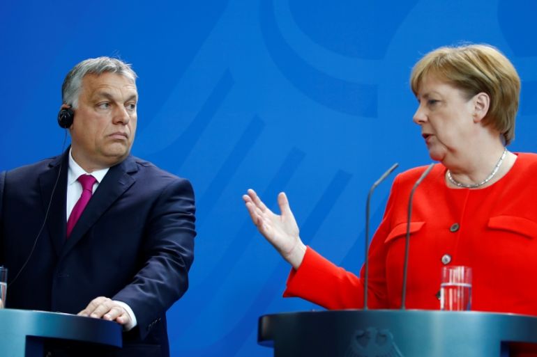 German Chancellor Angela Merkel and Hungarian Prime Minister Viktor Orban talk to the media after a meeting in Berlin
