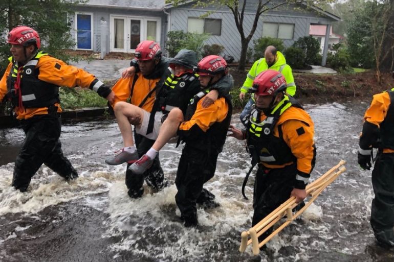 Search and Rescue workers from New York rescue a man from flooding caused by Hurricane Florence in River Bend