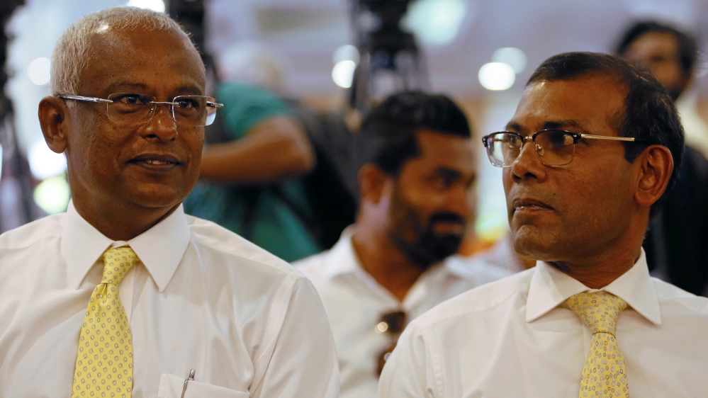 Ibrahim Mohamed Solih (left) has promised to free dissidents including exiled opposition leader Mohamed Nasheed (right) [File: Dinuka Liyanawatte/Reuters]