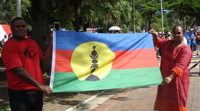 The distinctive Kanak flag is a symbol of the pro-independence movement in New Caledonia [Catherine Wilson/Al Jazeera]