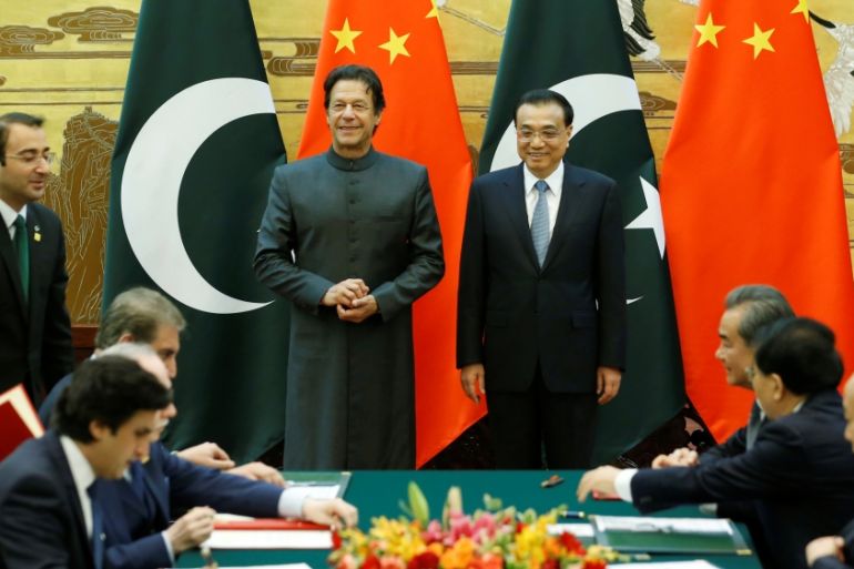 Pakistani Prime Minister Imran Khan and China''s Premier Li Keqiang attend a signing ceremony in Beijing
