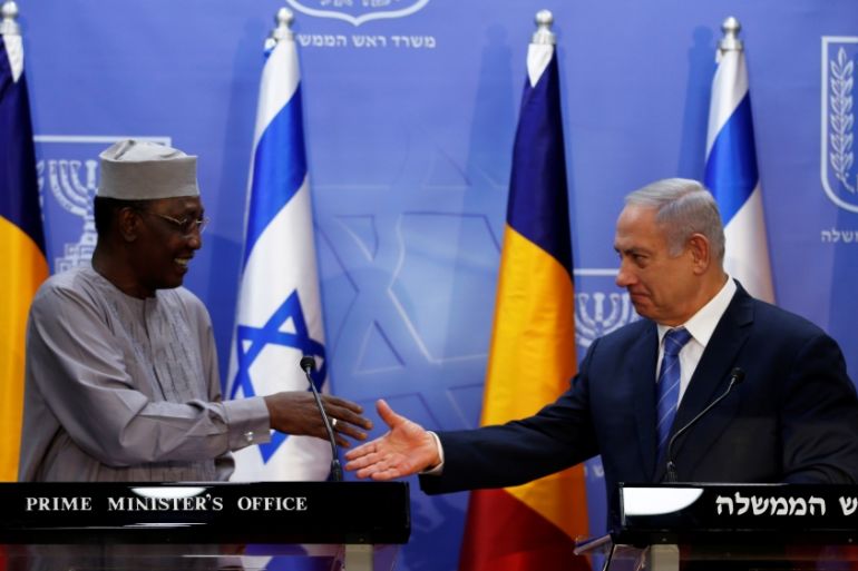 Israeli Prime Minister Benjamin Netanyahu prepares to shake hands with Chadian President Idriss Deby as they deliver joint statements in Jerusalem