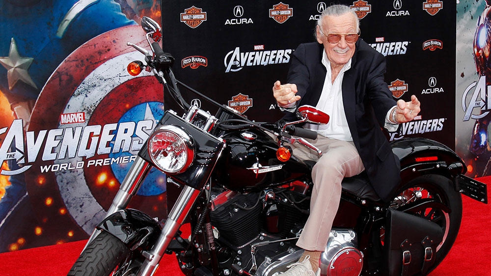 Comic book creator and executive producer Stan Lee poses on a motorcycle at the world premiere of the film Marvel's The Avengers in Hollywood [File: Danny Moloshok/Reuters] 