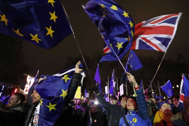 Anti-Brexit demonstrators react after the results of the vote on British Prime Minister Theresa May''s Brexit deal were announced in Parliament square in London, Tuesday, Jan. 15, 2019.