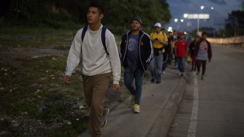 Migrants and asylum seekers part of a new caravan leaving Honduras set off from San Pedro Sula [Jeff Abbott/Al Jazeera] 
