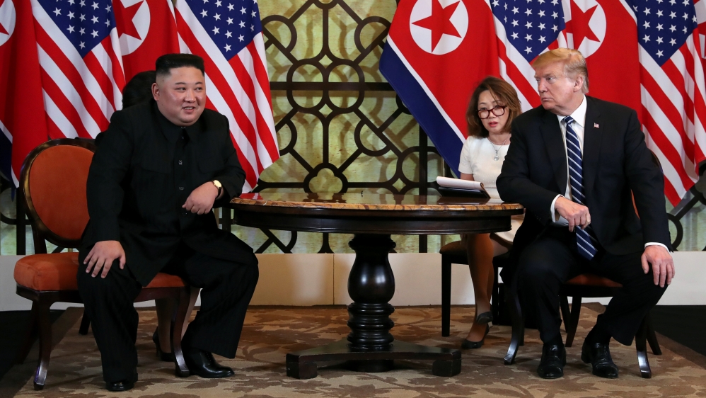 Kim and Trump at the start of their bilateral meeting on Thursday [Leah Millis/Reuters]