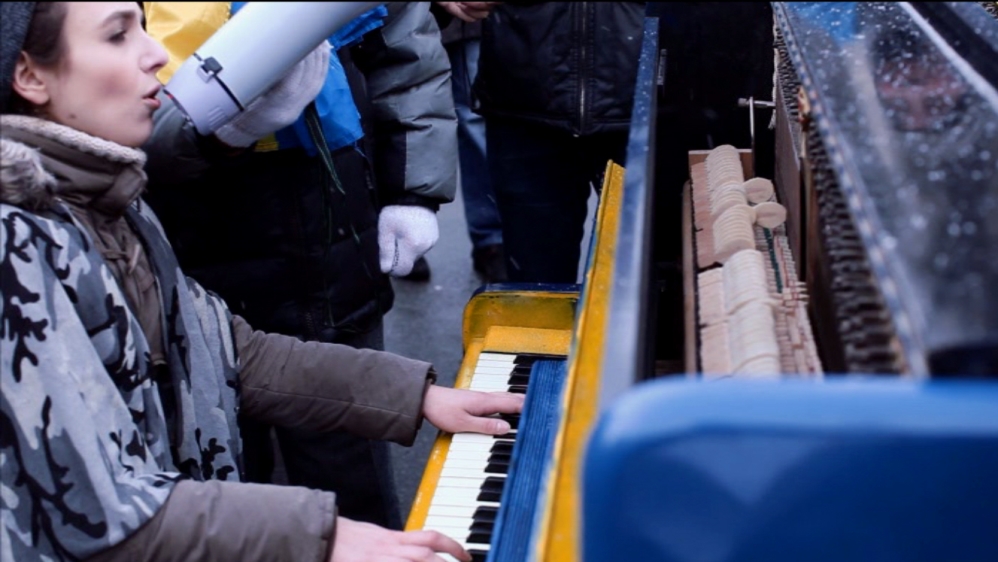 Several pianos were located on Maidan and were played in peaceful protest during Ukraine's 2014 uprising [Screengrab/Al Jazeera]