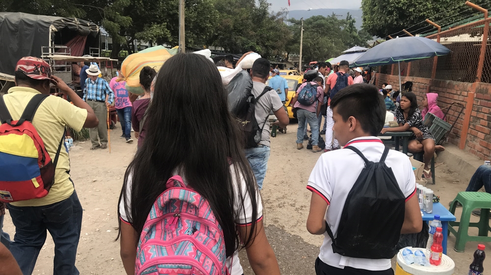 Cielo (pink bag) leaves her home at 04:30am each day to reach school in Colombia [Steven Grattan/Al Jazeera]