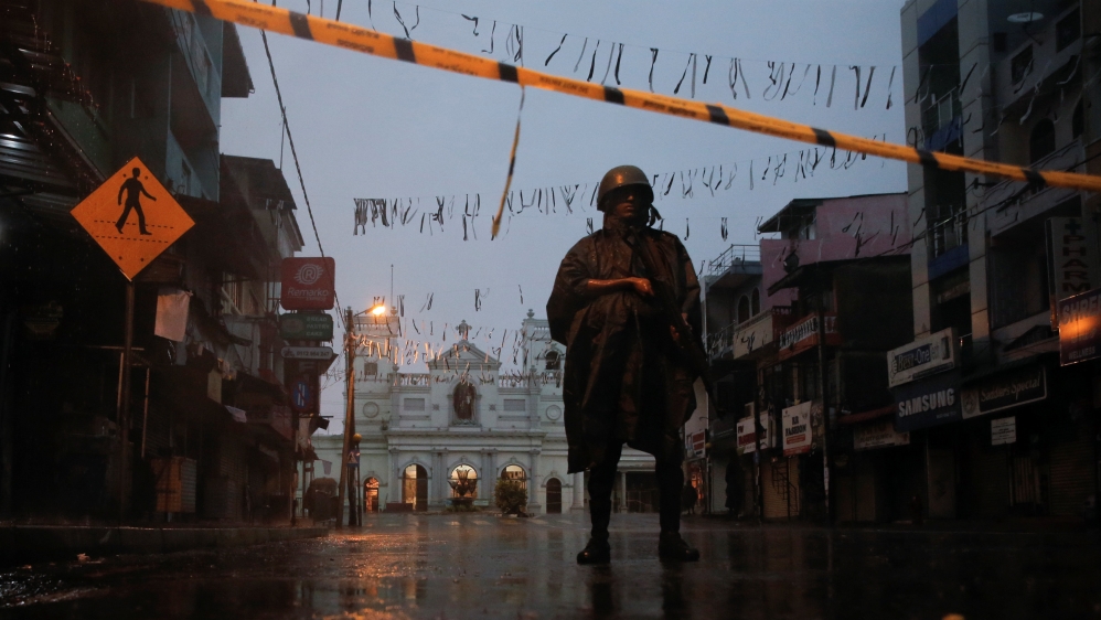 A soldier stands guard at St. Anthony's Shrine in Colombo [Thomas Peter/Reuters]