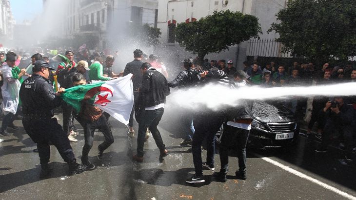Algerian security forces use a water canon to disperse students taking part in an anti-government demonstration in the capital Algiers on April 9, 2019. - Lawmakers named the speaker of the upper hous