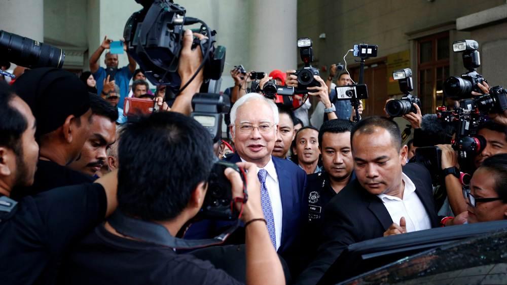Najib faces more than 40 corruption charges in relation to 1MDB, mostly money laundering but also abuse of power, criminal breach of trust and audit tampering [Lai Seng Sin/Reuters]