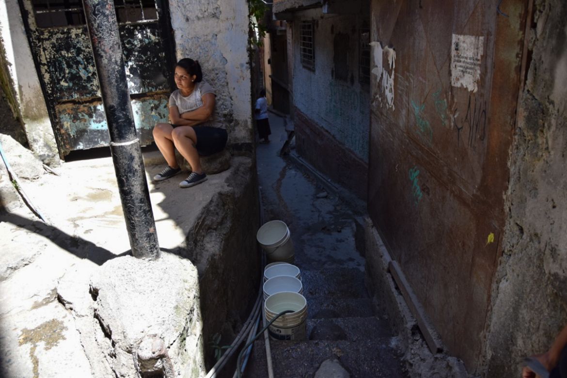 Living with a scarcity of water is becoming the norm in some areas, with many doing their best to collect it when it’s available [Elizabeth Melimopoulos/ Al Jazeera]