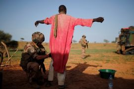 A French soldier searches a man during an area control operation in the Gourma region during Operation Barkhane in Ndaki, Mali, July 27, 2019 [Benoit Tessier/Reuters]