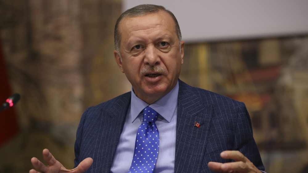 Turkish President Tayyip Erdogan talks to journalists in Istanbul, Turkey, October 13, 2019