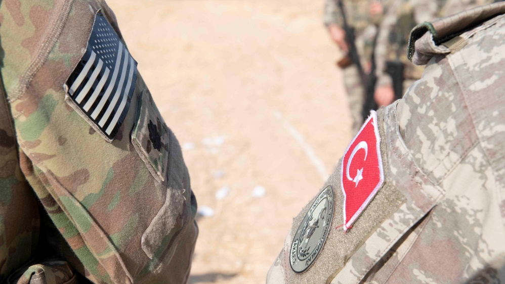 U.S. and Turkish military forces conduct a joint ground patrol inside the security mechanism area in northeast, Syria, October 4, 2019. Picture taken October 4, 2019