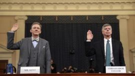 Career Foreign Service officer George Kent and top U.S. diplomat in Ukraine William Taylor, right, are sworn in to testify during the first public impeachment hearing of the House Intelligence Committ