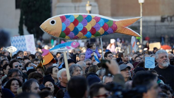 People gather in St. John at the Lateran Square for a demonstration of the "Sardines", an Italian grass-roots movement against right-wing populism, in central Rome, Saturday, Dec. 14, 2019.