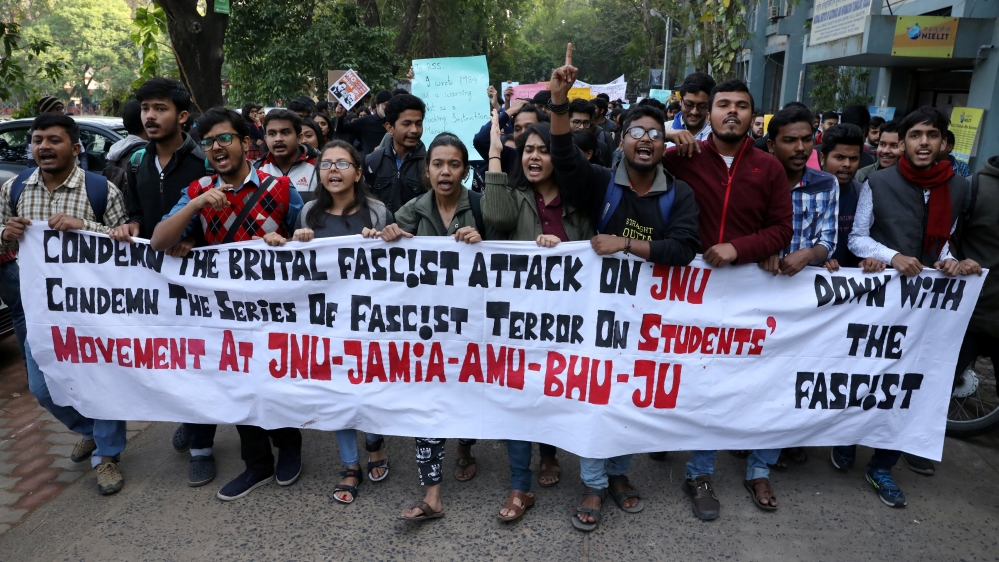 Demonstrators shout slogans during a protest against the attacks on the students of New Delhi's Jawaharlal Nehru University on Sunday, in Kolkata
