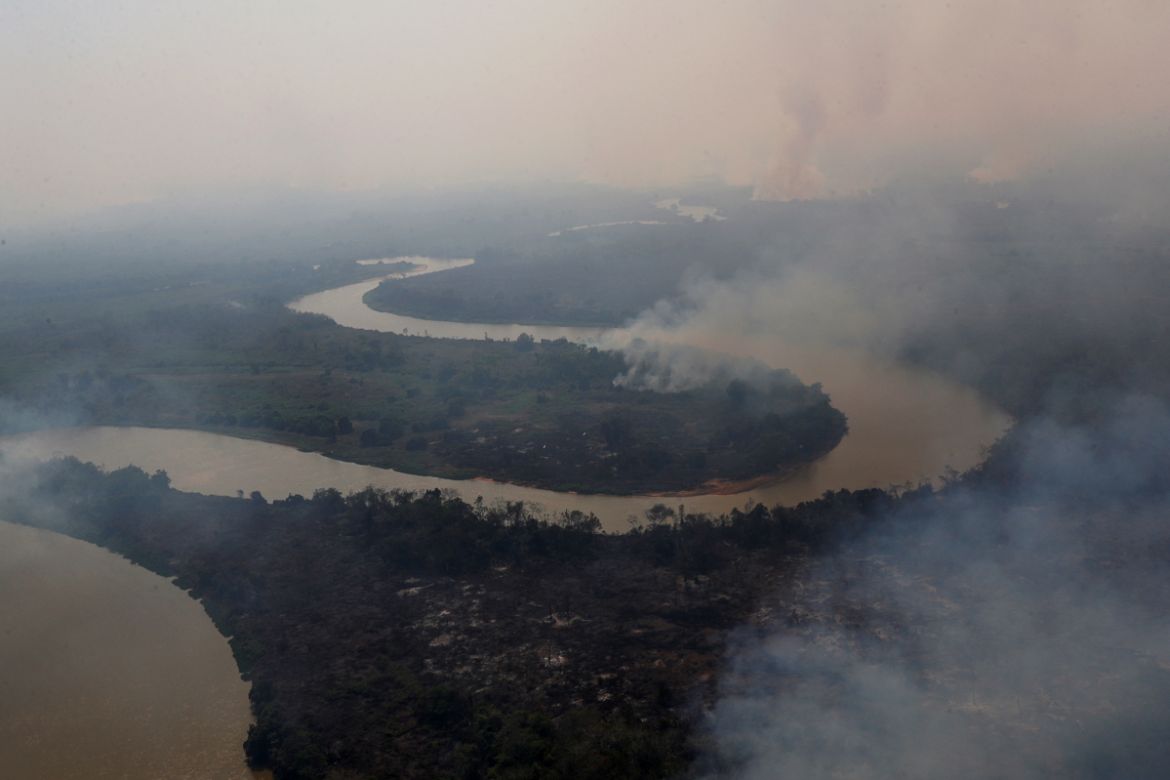 An aerial view shows smoke rising into the air around the Cuiaba river in the Pantanal, the world''s largest wetland, in Pocone, Mato Grosso state, Brazil, August 28, 2020. REUTERS/Amanda Perobelli SEA