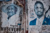 Posters of two most popular candidates for Uganda's Presidential election, incumbent President Yoweri Museveni (L) and Robert Kyagulanyi, aka Bobi Wine, the pop star-turned-opposition leader, are seen along a street in Kampala, Uganda, on January 6, 2021. - Uganda gears up for presidential elections which is scheduled to take place on January 14, 2021, as President Yoweri Museveni seeks another term to continue his 35-year rule.poster of Uganda's President Yoweri Museveni who is running for his 6th presidential term. (Photo by SUMY SADURNI / AFP) (AFP)