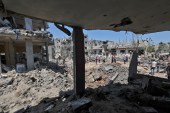 Palestinians assess the damage caused by Israeli air strikes, in Beit Hanoun in the northern Gaza Strip [Mahmud Hams/AFP]