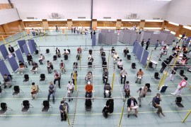 People gather to receive coronavirus vaccines at a newly-opened mass vaccination centre in Toyoake City, Aichi prefecture on [Jiji press/ AFP]