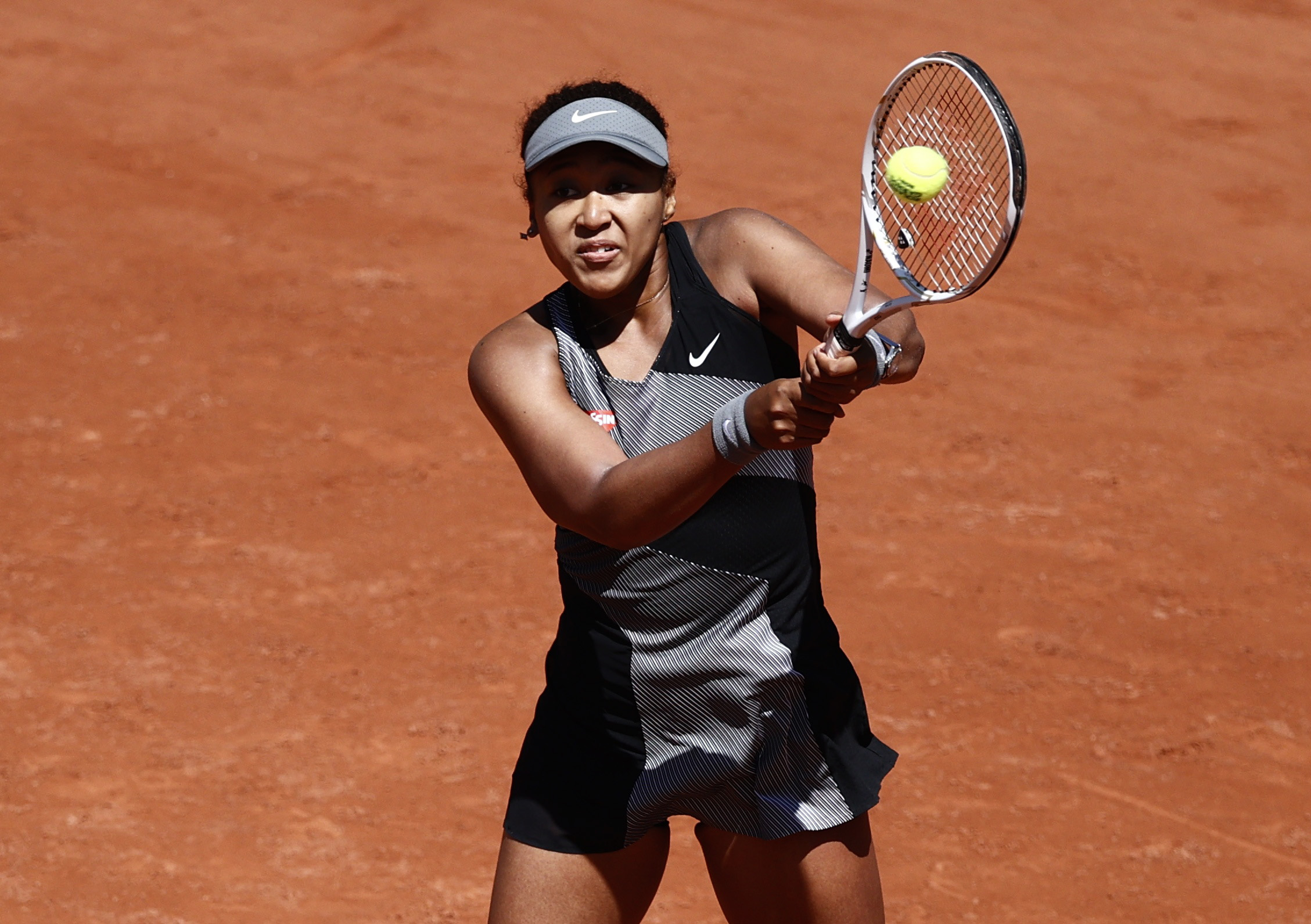 Japan's Naomi Osaka in action during her first round match against Romania's Patricia Maria
