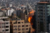 An Israeli airstrike hits the high-rise building housing Al Jazeera and The Associated Press' offices in Gaza City [Hatem Moussa/AP]