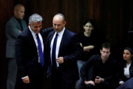 Yair Lapid, second left, and Naftali Bennett, next to him, in the Knesset [File: Baz Ratner/Reuters]