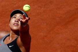 Japan's Naomi Osaka in action during her first-round match against Romania's Patricia Maria Tig, May 30, 2021 [File: Christian Hartmann/Reuters]