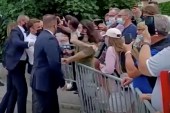 French President Emmanuel Macron gets slapped by a member of the public during a visit in Tain-L'Hermitage, France, in this still image taken from video on June 8, 2021 [BFMTV/ReutersTV via Reuters]