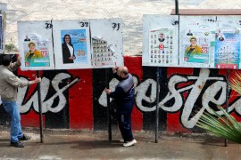 About 24 million Algerians are eligible to vote to elect 407 members of the People's National Assembly for a five-year term [Ramzi Boudina/Reuters]