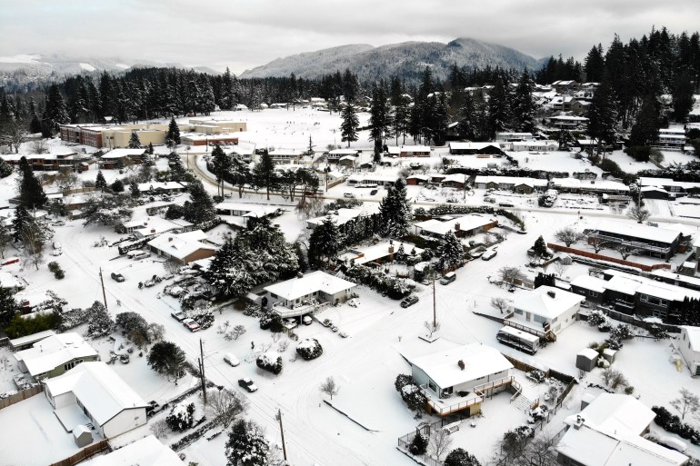 Snow covers streets, sidewalks and homes where nearly a foot of snow fell over December 25-26 in Bellingham Washington state, US 