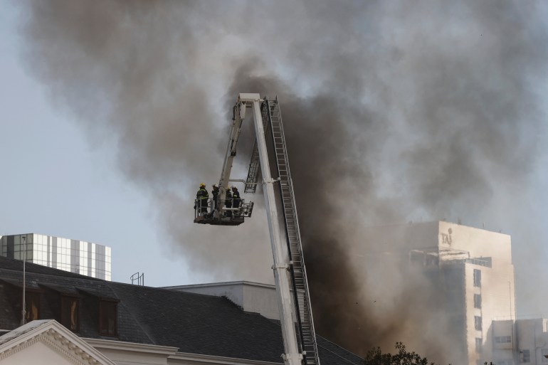 Firefighters are battling to contain a fire at the South African Parliament precinct in Cape Town.
