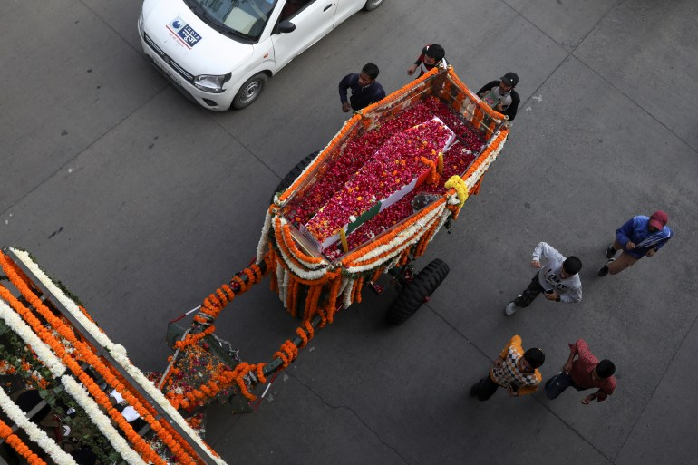 The coffin of India's Chief of Defence Staff General Bipin Rawat, covered in flowers is seen from above