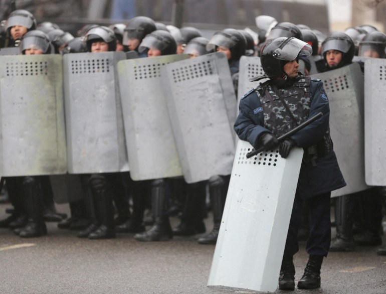 Kazakh security forces block a street in the country's main city of in Almaty