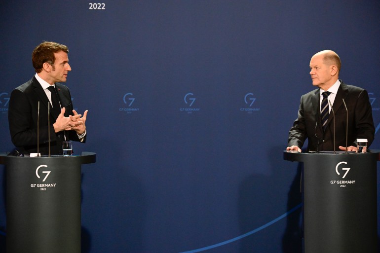 French President Emmanuel Macron, left, and German Chancellor Olaf Scholz attend a media conference