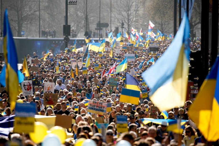 Demonstrators take part in the 'London stands with Ukraine' solidarity march, called by Mayor of London Sadiq Khan, in London, Saturday, March 26, 2022. 