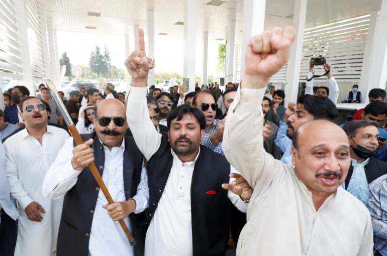 Supporters of the united opposition chant slogans outside parliament building Islamabad